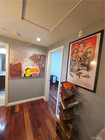 a bedroom with a bed and cabinets