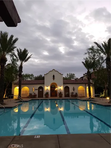 an aerial view of swimming pool having outdoor seating