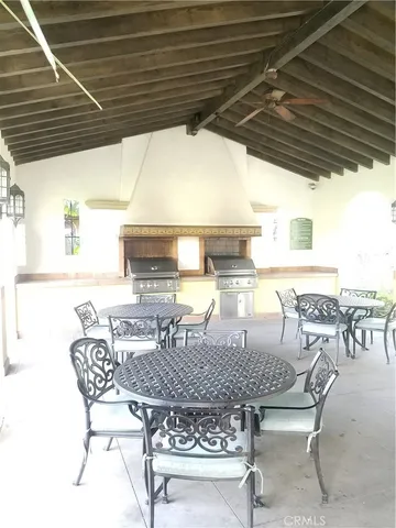 a dinning table and chairs in a patio