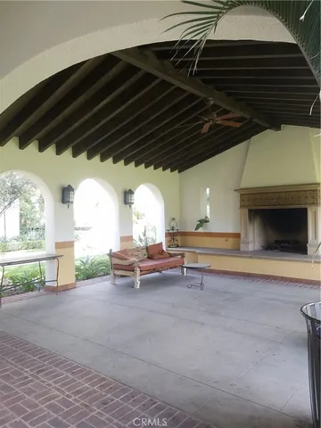a view of backyard with barbeque grill and a table and chairs