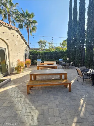 a swimming pool with outdoor seating and outdoor seating