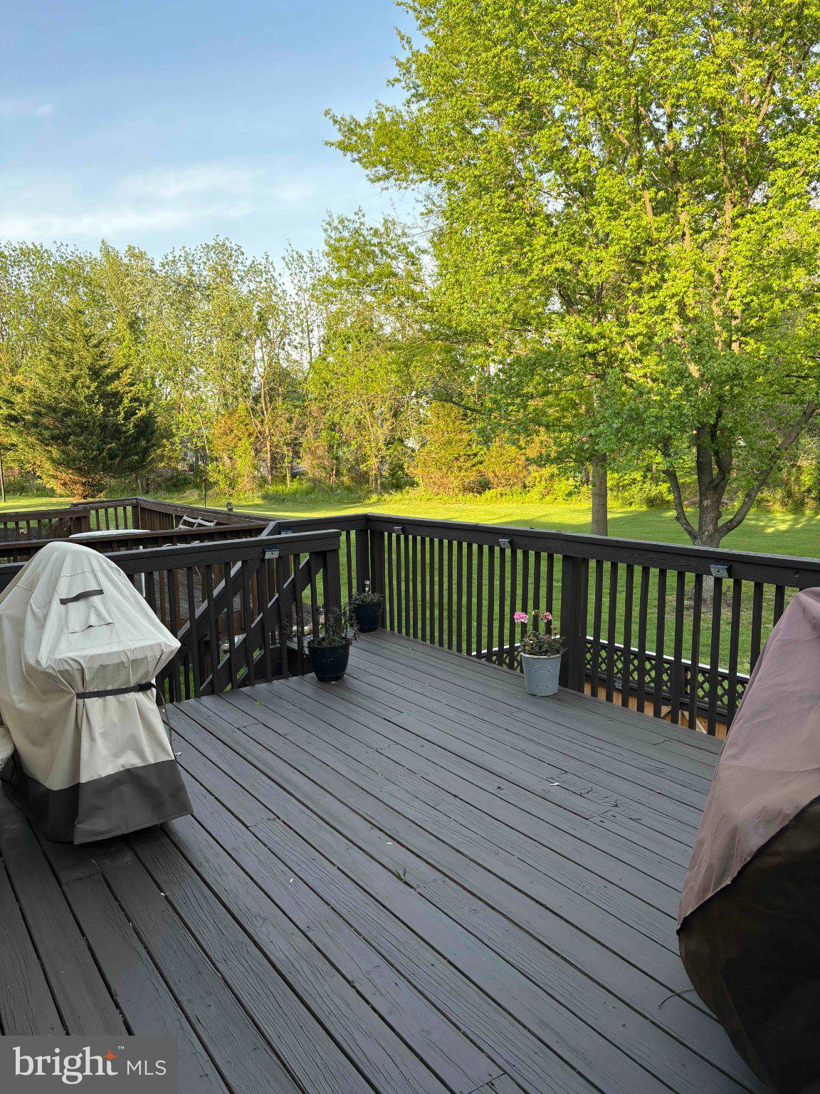 5 Corlen Court, Unit 5 Medford, NJ 08055 - Photo 13 of 33 a balcony with wooden floor table and chairs