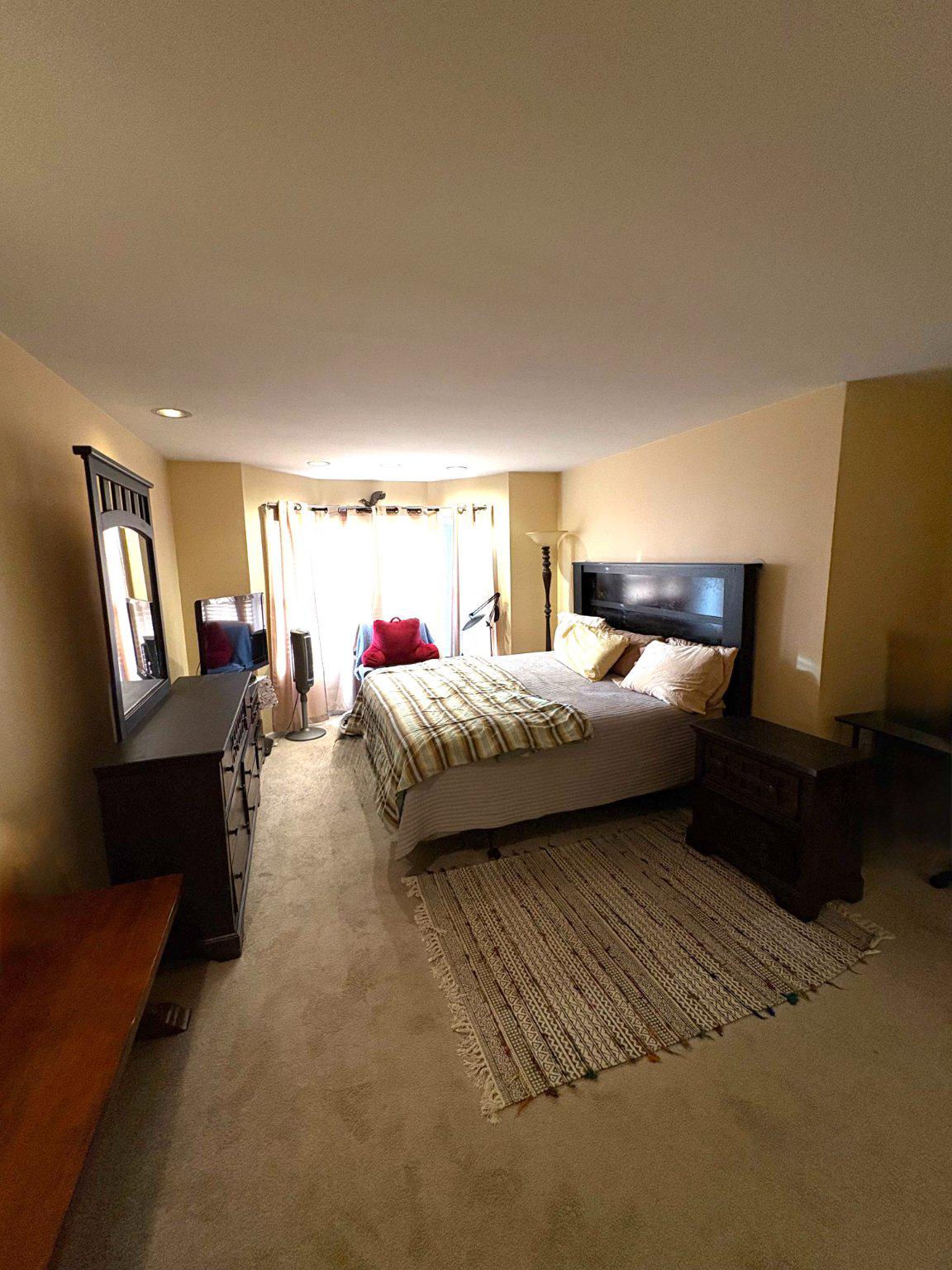 5 Corlen Court, Unit 5 Medford, NJ 08055 - Photo 18 of 33 a bedroom with a bed couch and window