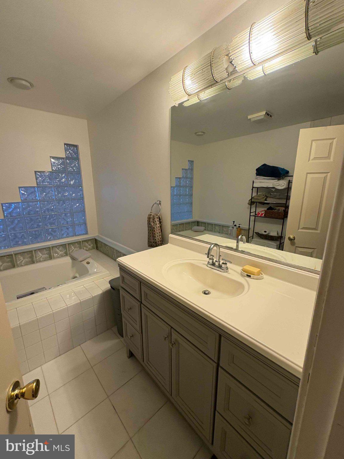 5 Corlen Court, Unit 5 Medford, NJ 08055 - Photo 19 of 33 a bathroom with a tub sink and mirror