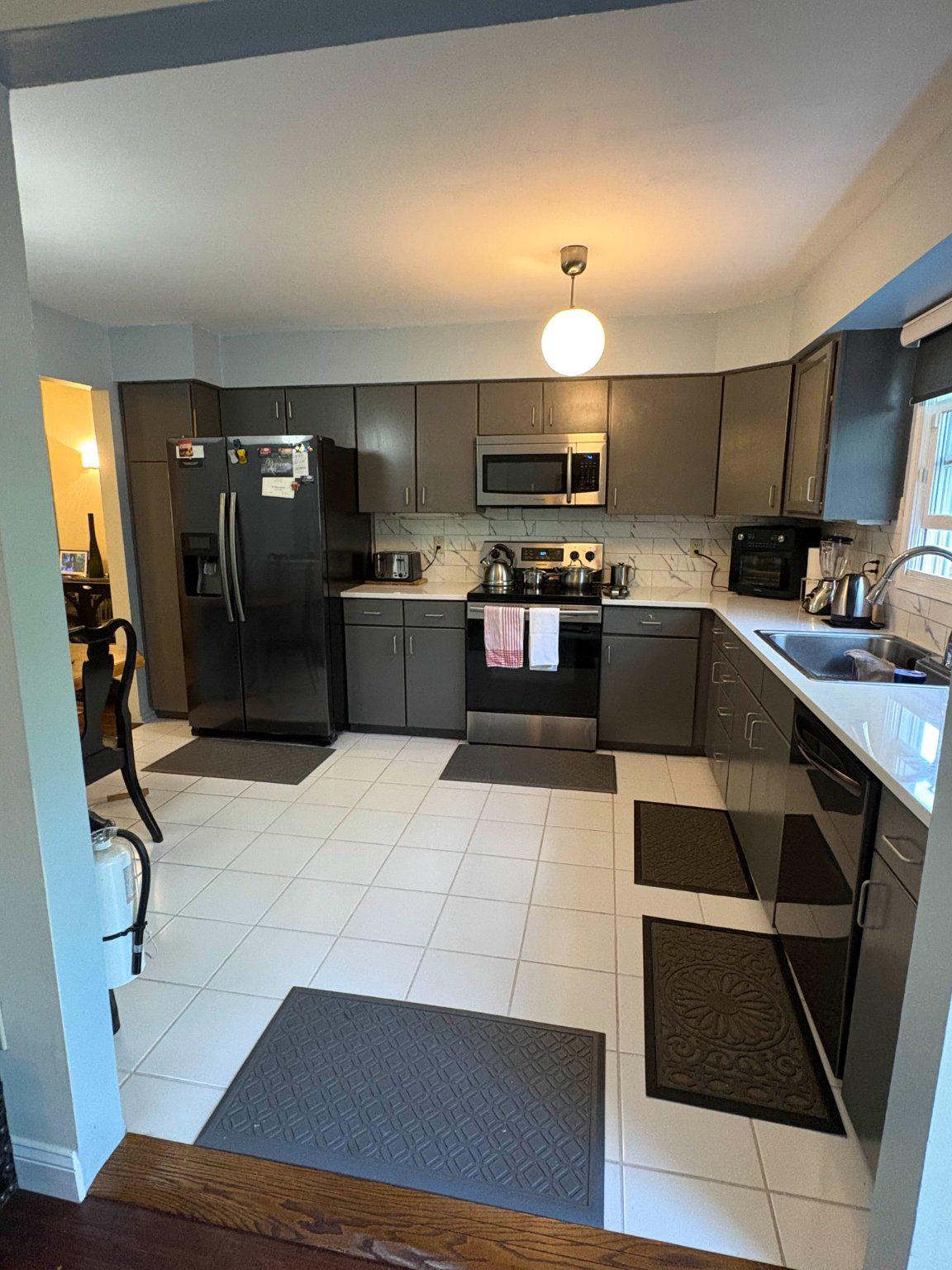 5 Corlen Court, Unit 5 Medford, NJ 08055 - Photo 10 of 33 a kitchen with stainless steel appliances kitchen island granite countertop a sink counter space and cabinets