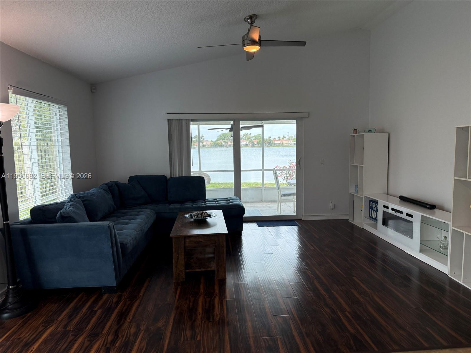 3091 Lighthouse Place Margate, FL 33063 - Photo 19 of 38 a living room with furniture and a wooden floor