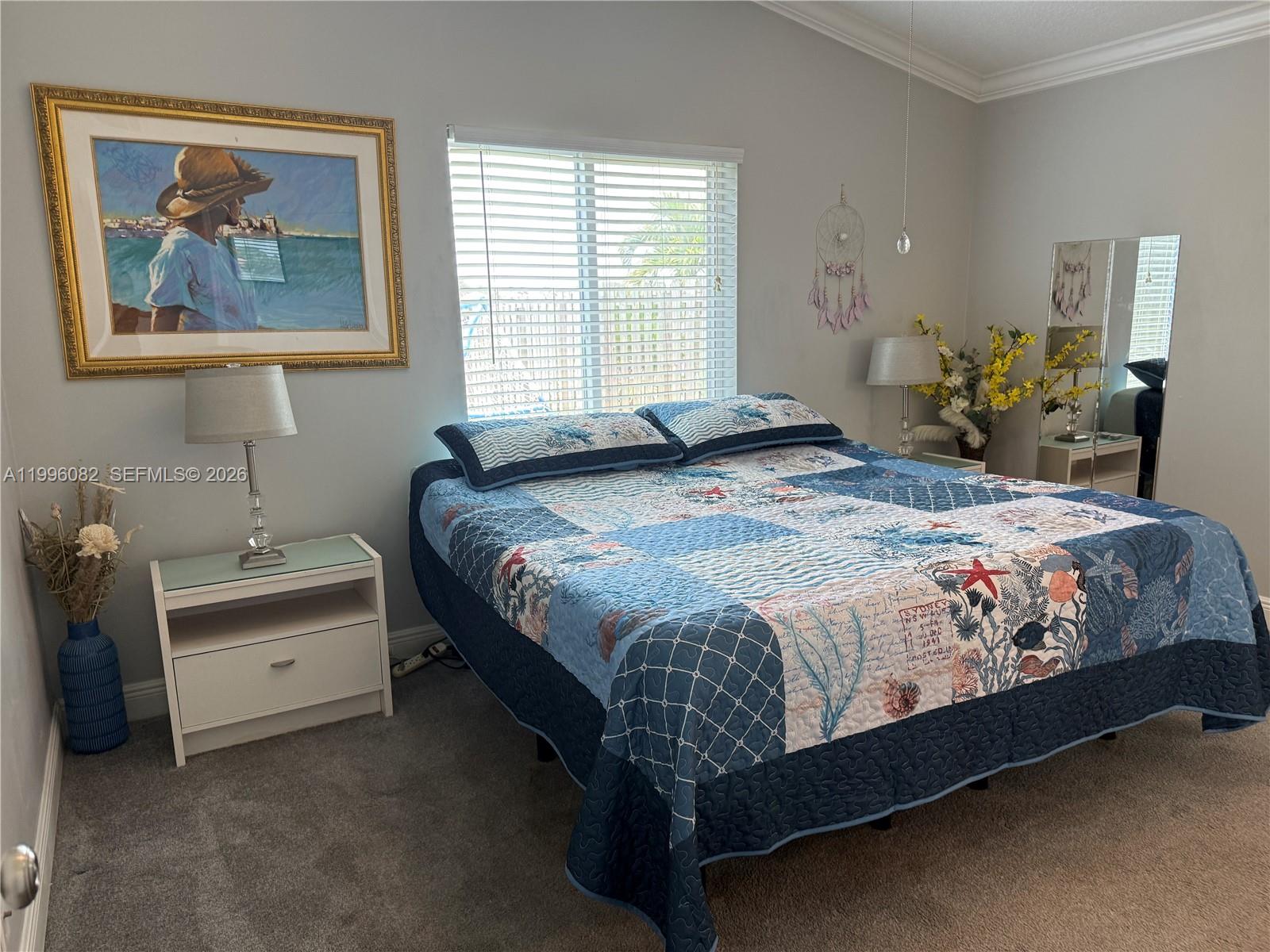 3091 Lighthouse Place Margate, FL 33063 - Photo 20 of 38 a bedroom with a bed and a table