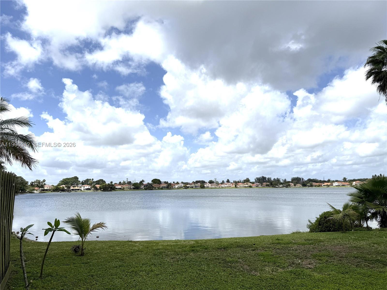 3091 Lighthouse Place Margate, FL 33063 - Photo 2 of 38 a view of a lake from a yard
