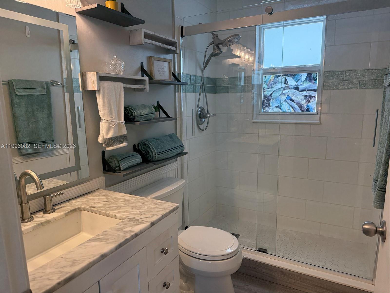 3091 Lighthouse Place Margate, FL 33063 - Photo 24 of 38 a bathroom with a granite countertop sink toilet and shower