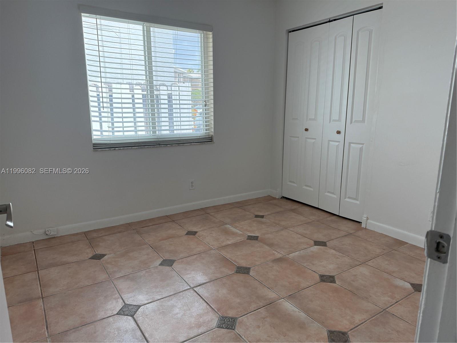 3091 Lighthouse Place Margate, FL 33063 - Photo 27 of 38 a view of an empty room with a window