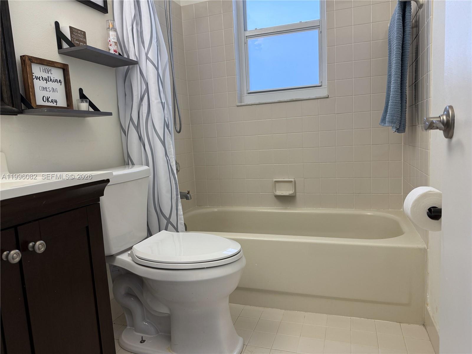 3091 Lighthouse Place Margate, FL 33063 - Photo 29 of 38 a bathroom with a toilet and a tub