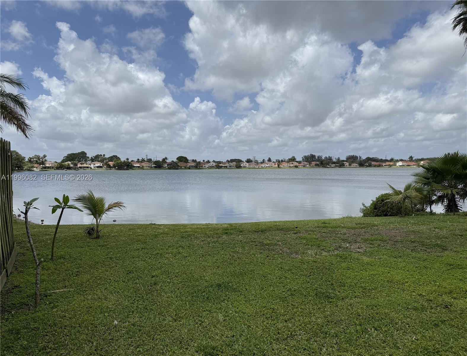 3091 Lighthouse Place Margate, FL 33063 - Photo 33 of 38 a view of a lake with houses in the back