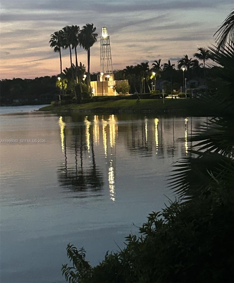 3091 Lighthouse Place Margate, FL 33063 - Photo 35 of 38 a view of a lake with houses in back