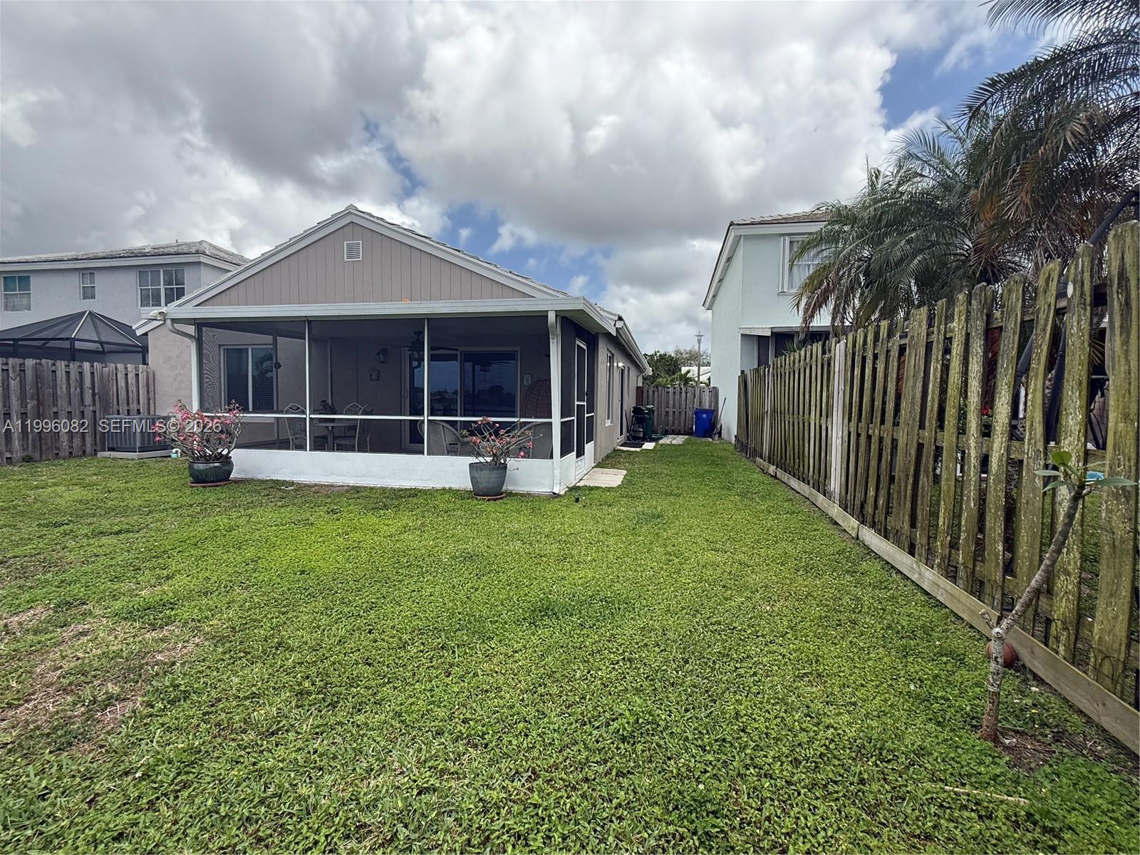 3091 Lighthouse Place Margate, FL 33063 - Photo 36 of 38 a front view of a house with garden