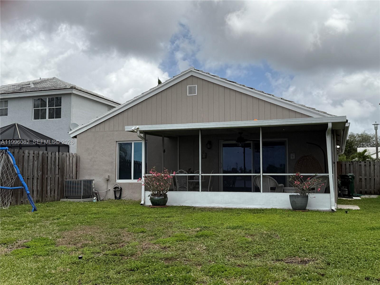 3091 Lighthouse Place Margate, FL 33063 - Photo 6 of 38 a front view of a house with garden
