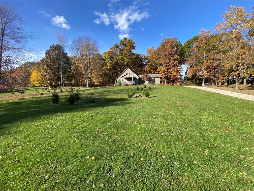 250 Lowman Road Indiana, PA 15701 - Photo 2 of 11 a front view of a house with garden and trees