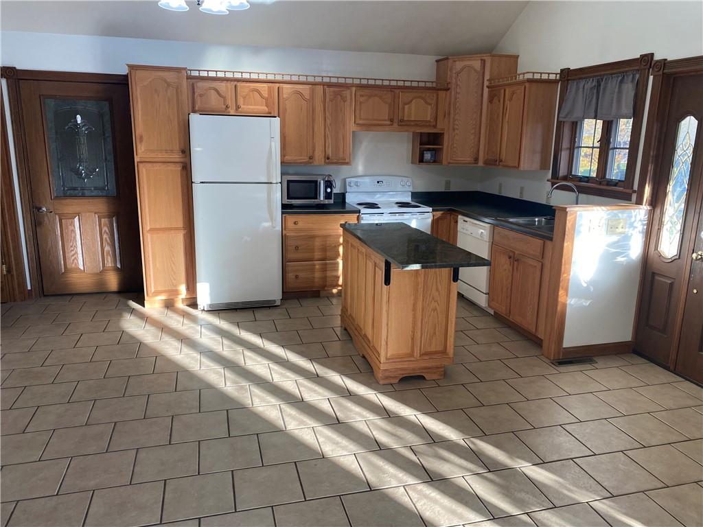 250 Lowman Road Indiana, PA 15701 - Photo 5 of 11 a kitchen with stainless steel appliances a refrigerator sink and cabinets