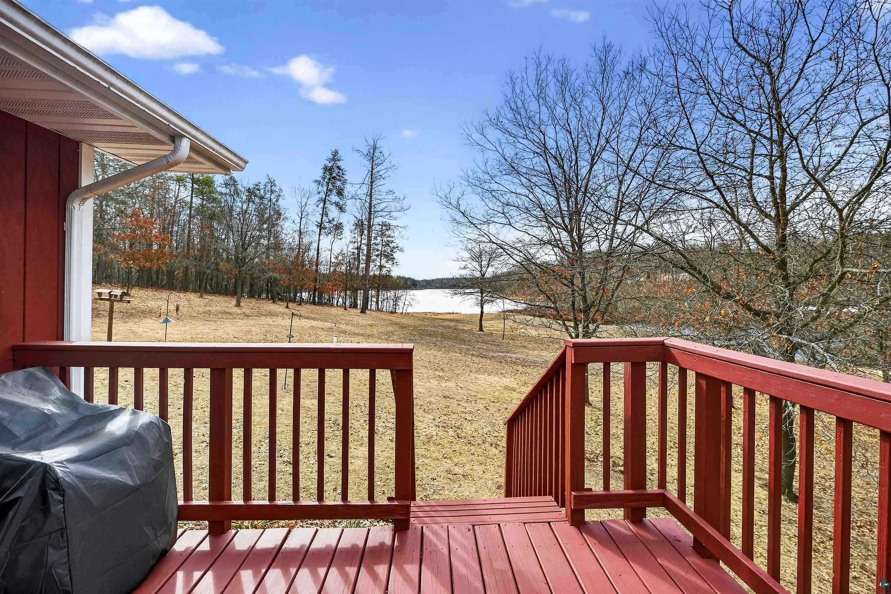 11702 East Mail Road Gordon, WI 54838 - Photo 12 of 49 Deck with a grill, a water view, and a yard
