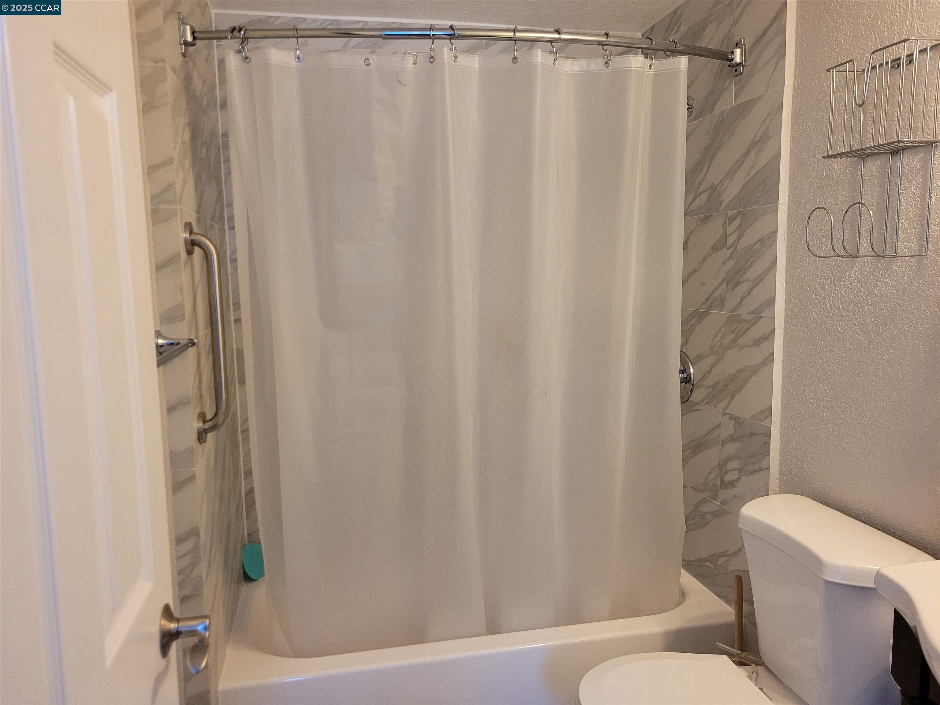 1181 Danville Boulevard, Unit E Alamo, CA 94507 - Photo 11 of 11 a bathroom with a shower curtain and sink