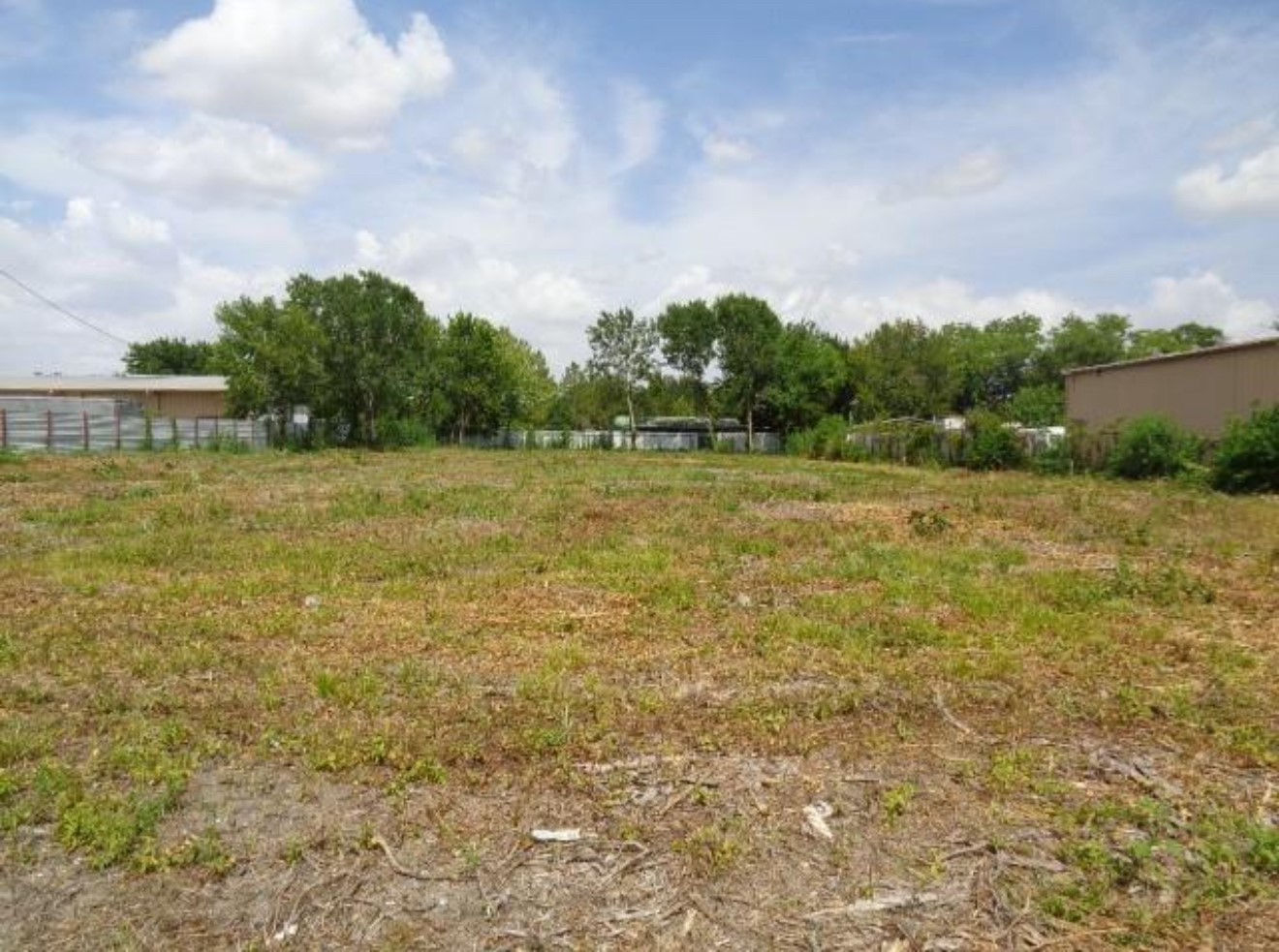 0 Hiram Clarke Road Houston, TX 77045 - Photo 1 of 10 a view of a field with trees in the background