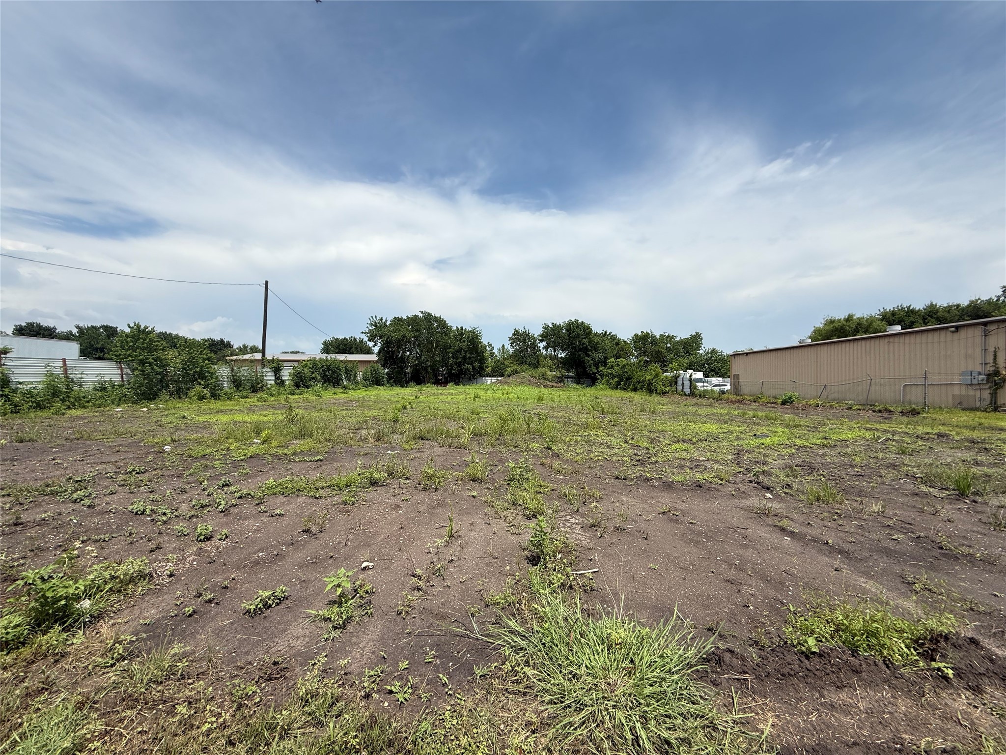 0 Hiram Clarke Road Houston, TX 77045 - Photo 7 of 10 a view of a field with wooden fence