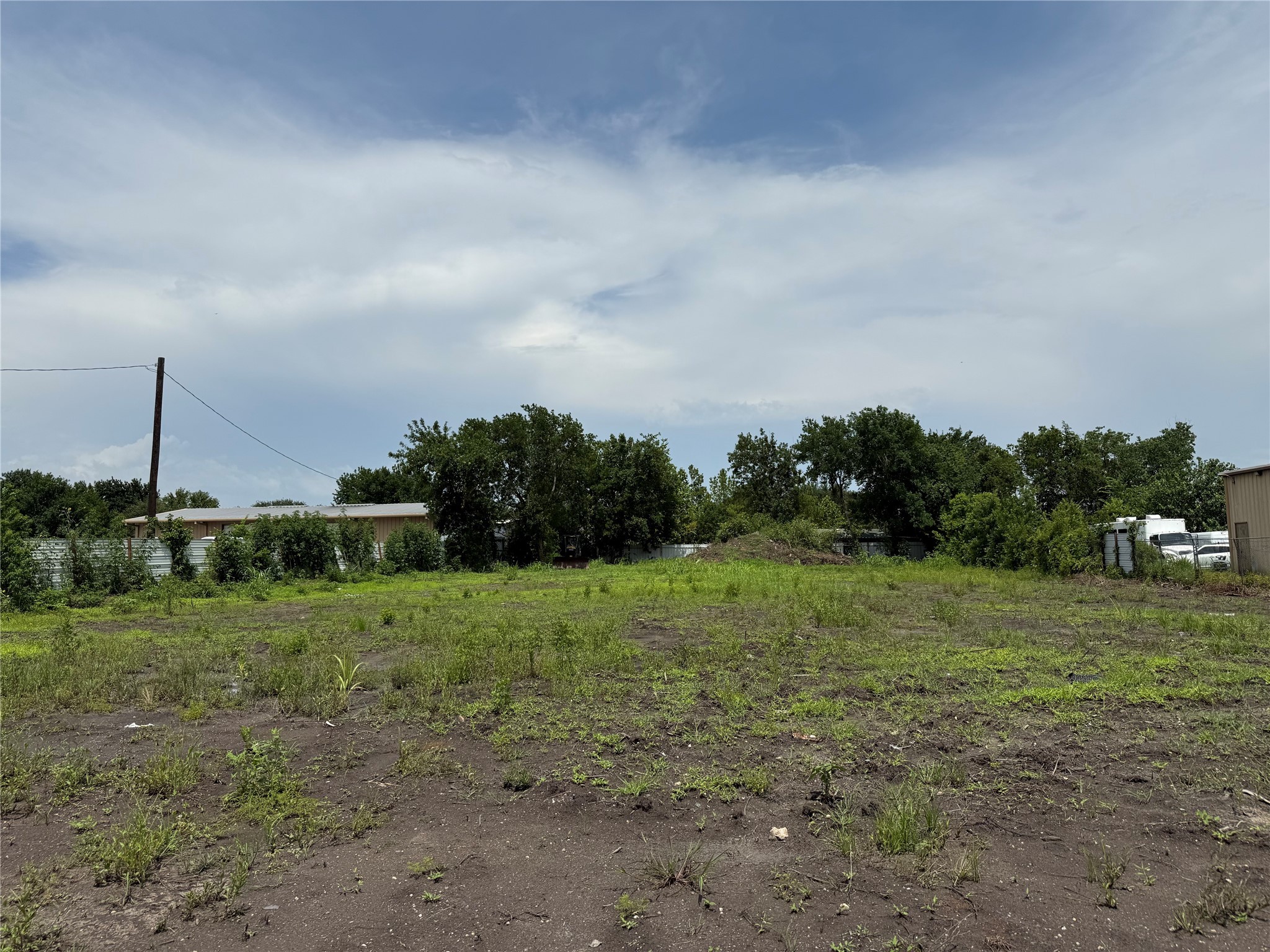 0 Hiram Clarke Road Houston, TX 77045 - Photo 8 of 10 a view of a field with trees in background