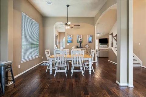 a view of a dining room with furniture window and wooden floor