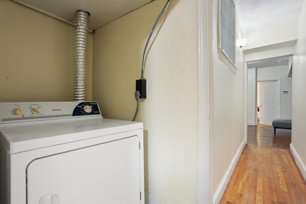 55 A Lanark Road, Unit A Boston, MA 02135 - Photo 14 of 18 a utility room with dryer and washer