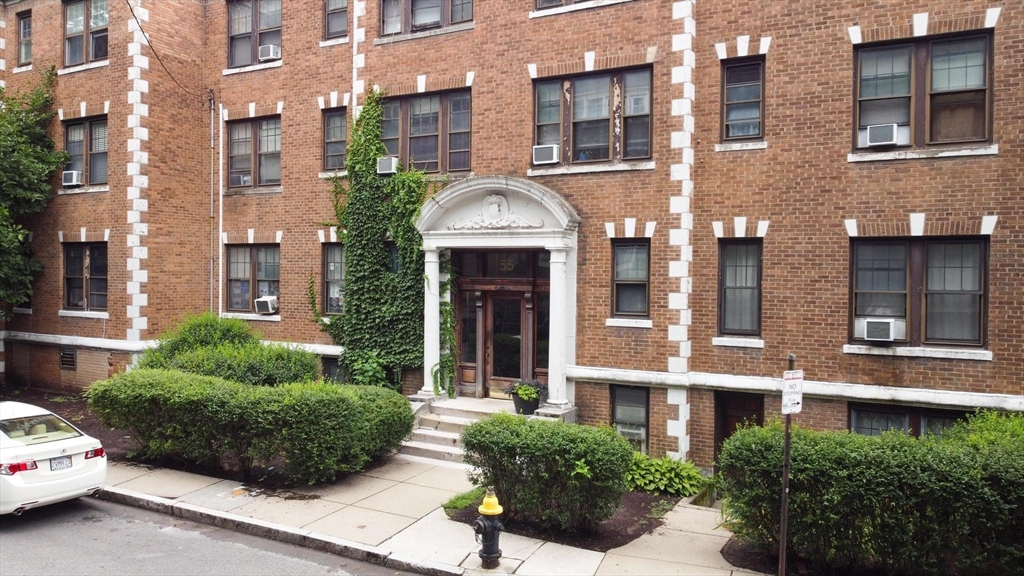 55 A Lanark Road, Unit A Boston, MA 02135 - Photo 16 of 18 a front view of a multi story residential apartment building