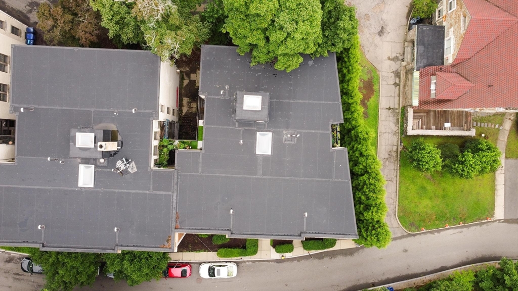 55 A Lanark Road, Unit A Boston, MA 02135 - Photo 18 of 18 an aerial view of a house with a yard and a fountain
