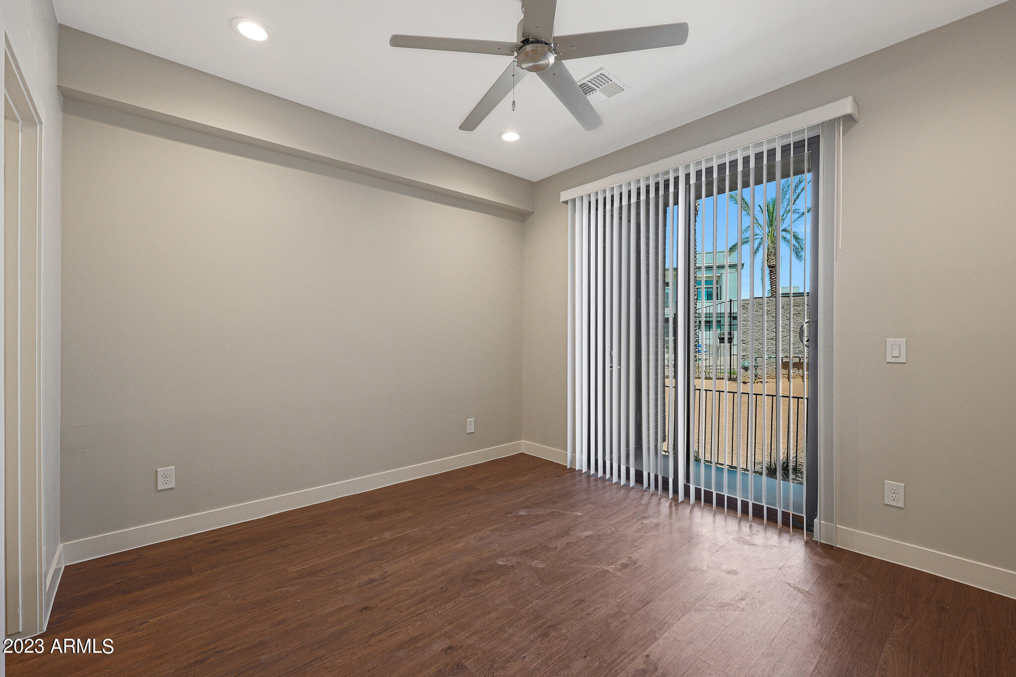 6060 East Baseline Road, Unit 138 Mesa, AZ 85206 - Photo 15 of 45 wooden floor in an empty room with a window