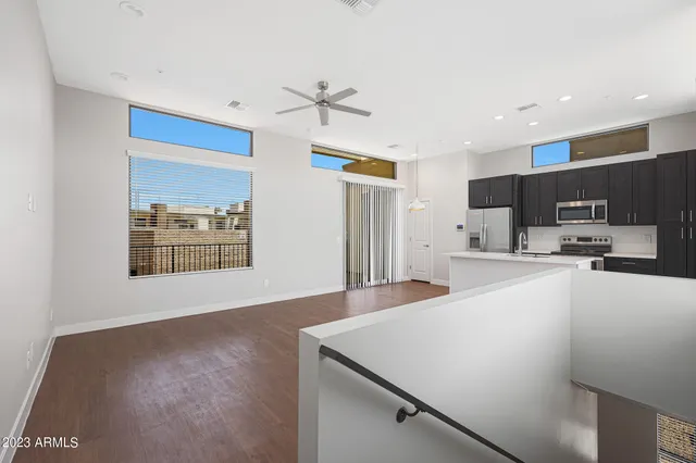 a view of kitchen with stainless steel appliances refrigerator oven and cabinets