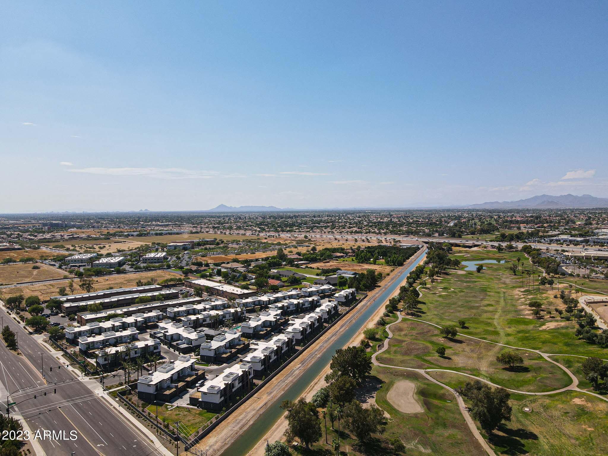 6060 East Baseline Road, Unit 138 Mesa, AZ 85206 - Photo 43 of 45 an aerial view of residential building and ocean view