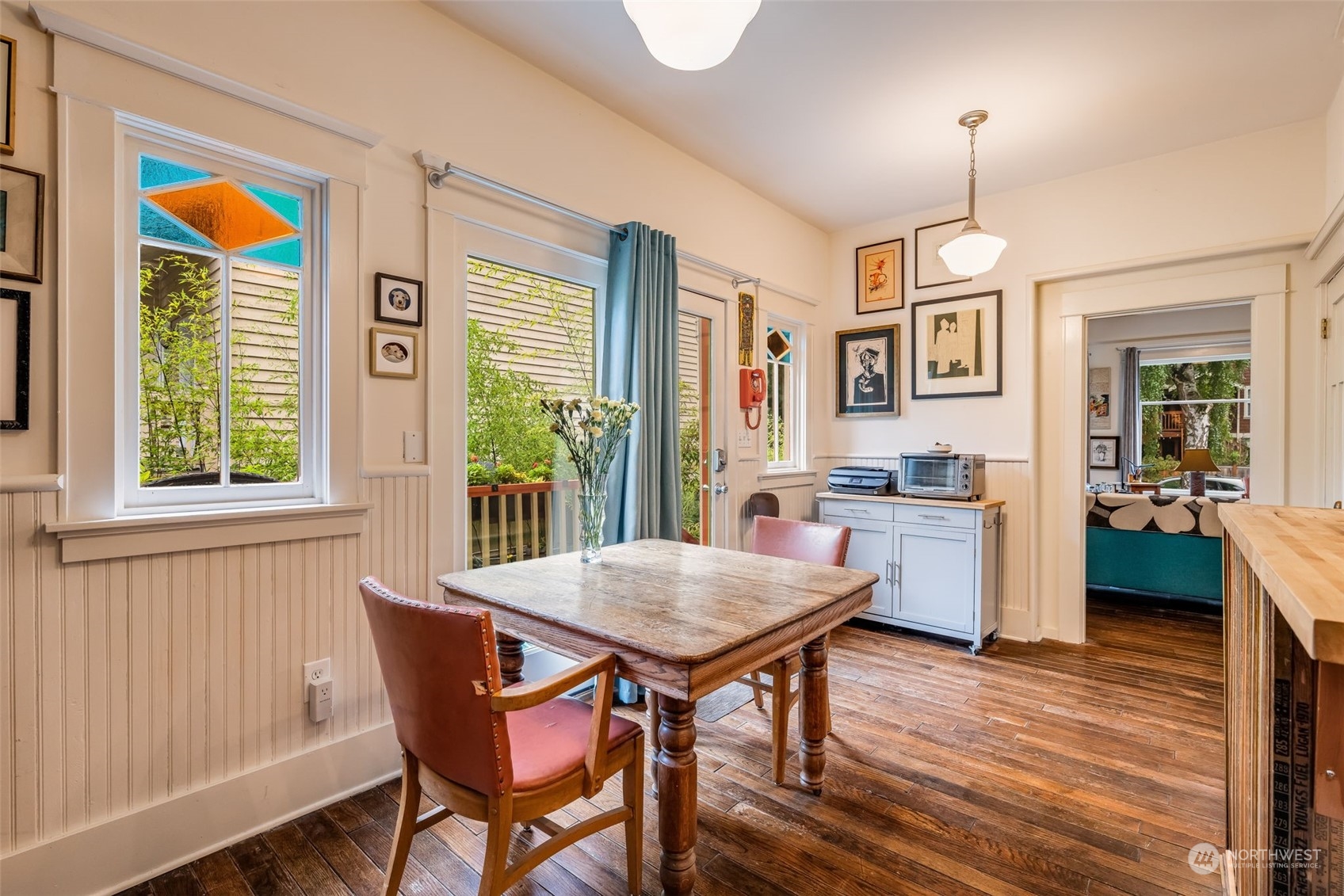 926 18th Avenue Seattle, WA 98122 - Photo 17 of 38 a view of a dining room with furniture window and wooden floor