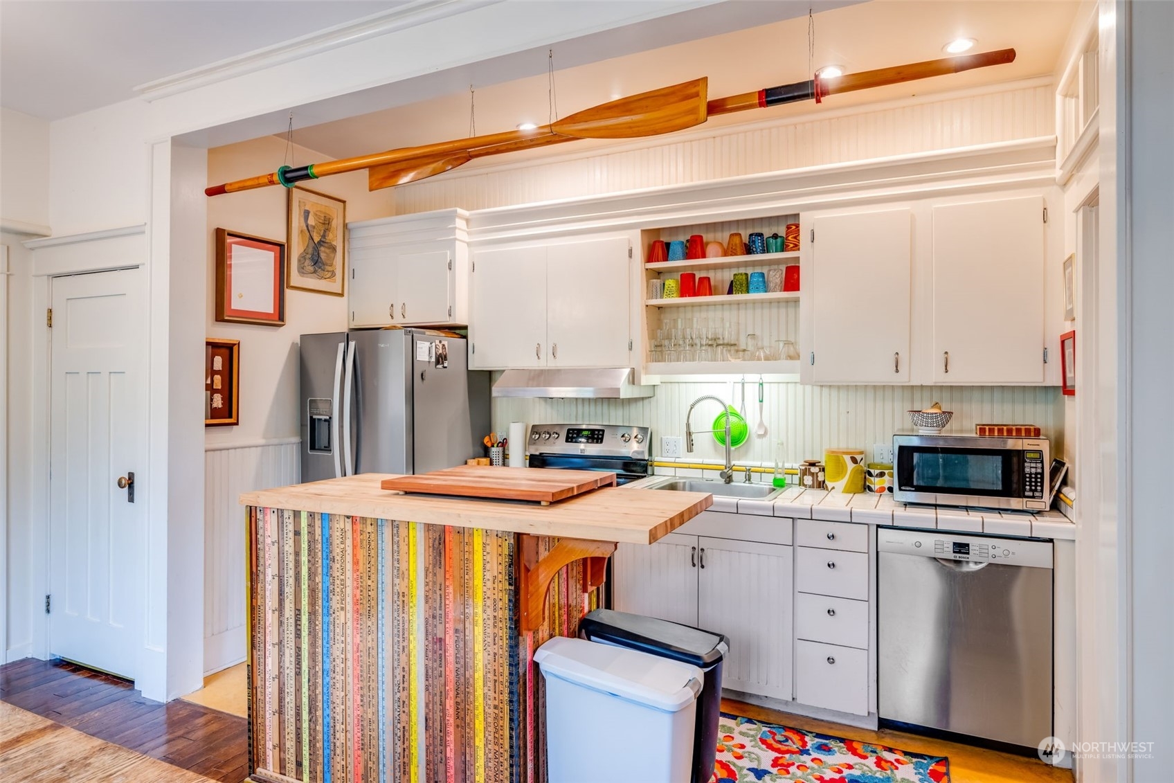 926 18th Avenue Seattle, WA 98122 - Photo 18 of 38 a kitchen with a refrigerator and a stove top oven