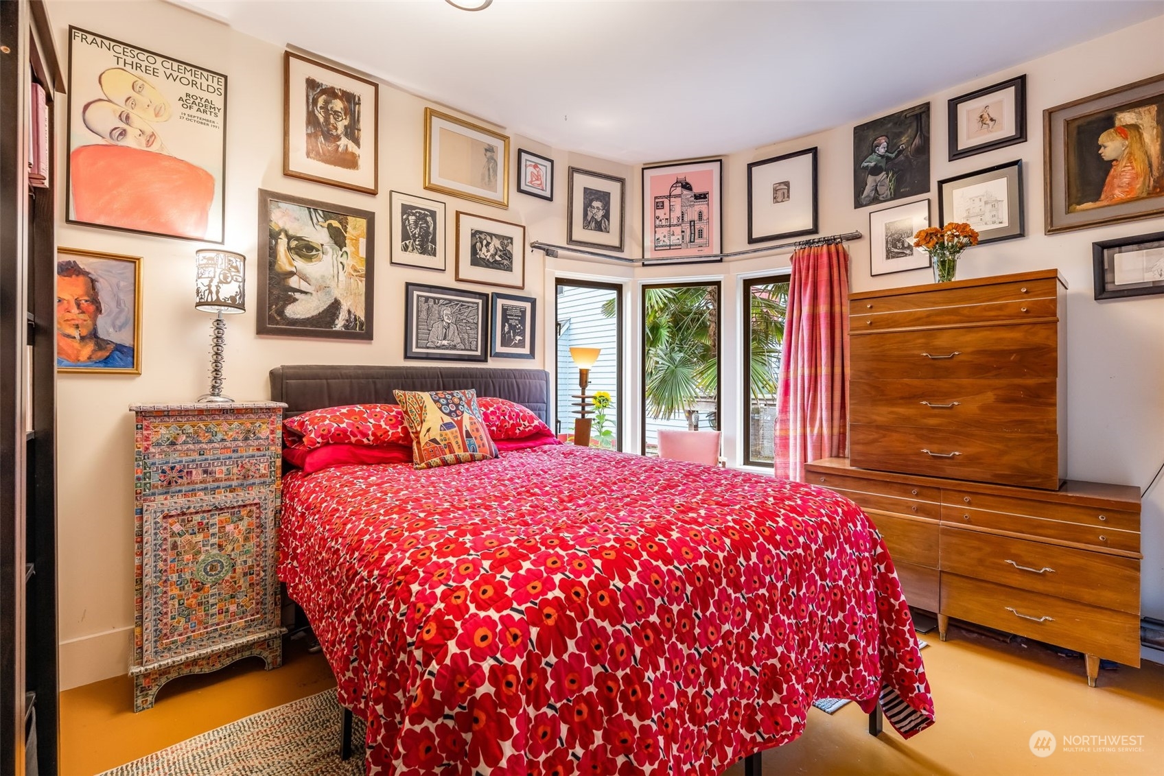 926 18th Avenue Seattle, WA 98122 - Photo 19 of 38 a bedroom with a bed and a painting on the wall