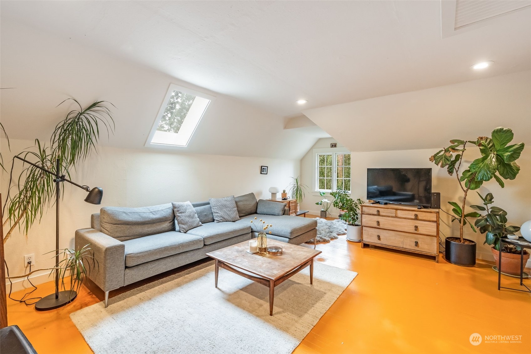 926 18th Avenue Seattle, WA 98122 - Photo 22 of 38 a living room with furniture and a flat screen tv