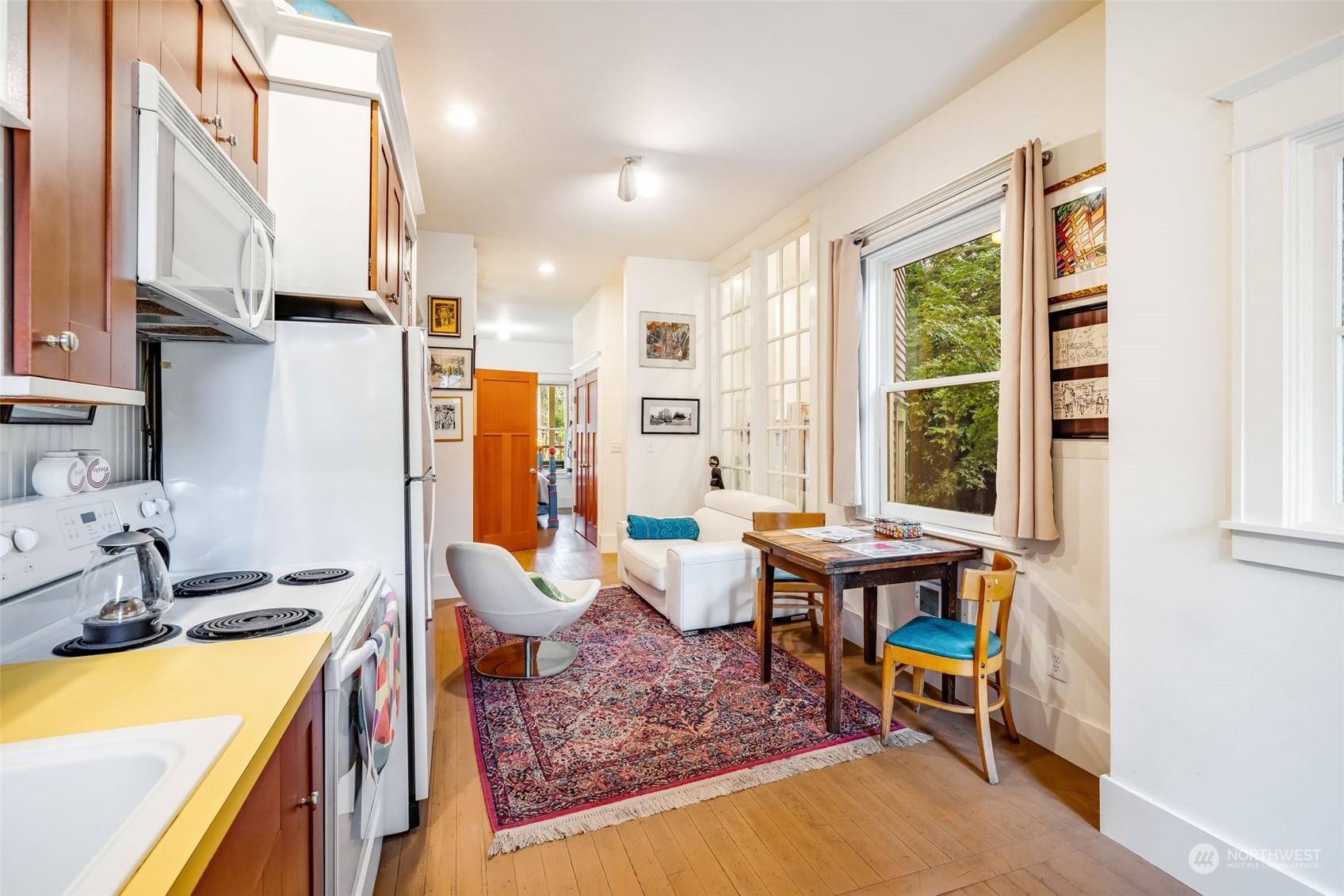 926 18th Avenue Seattle, WA 98122 - Photo 30 of 38 a kitchen with stainless steel appliances granite countertop sink and a refrigerator
