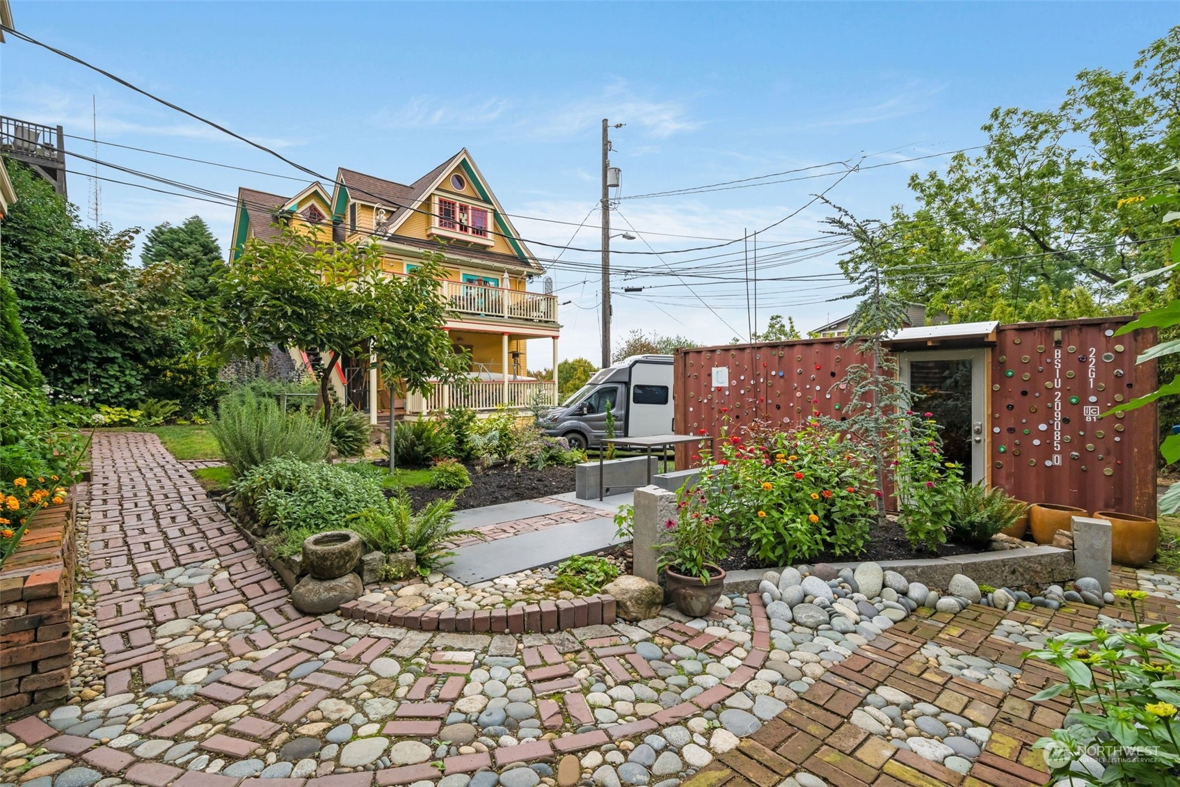 926 18th Avenue Seattle, WA 98122 - Photo 3 of 38 a view of a street with potted plants