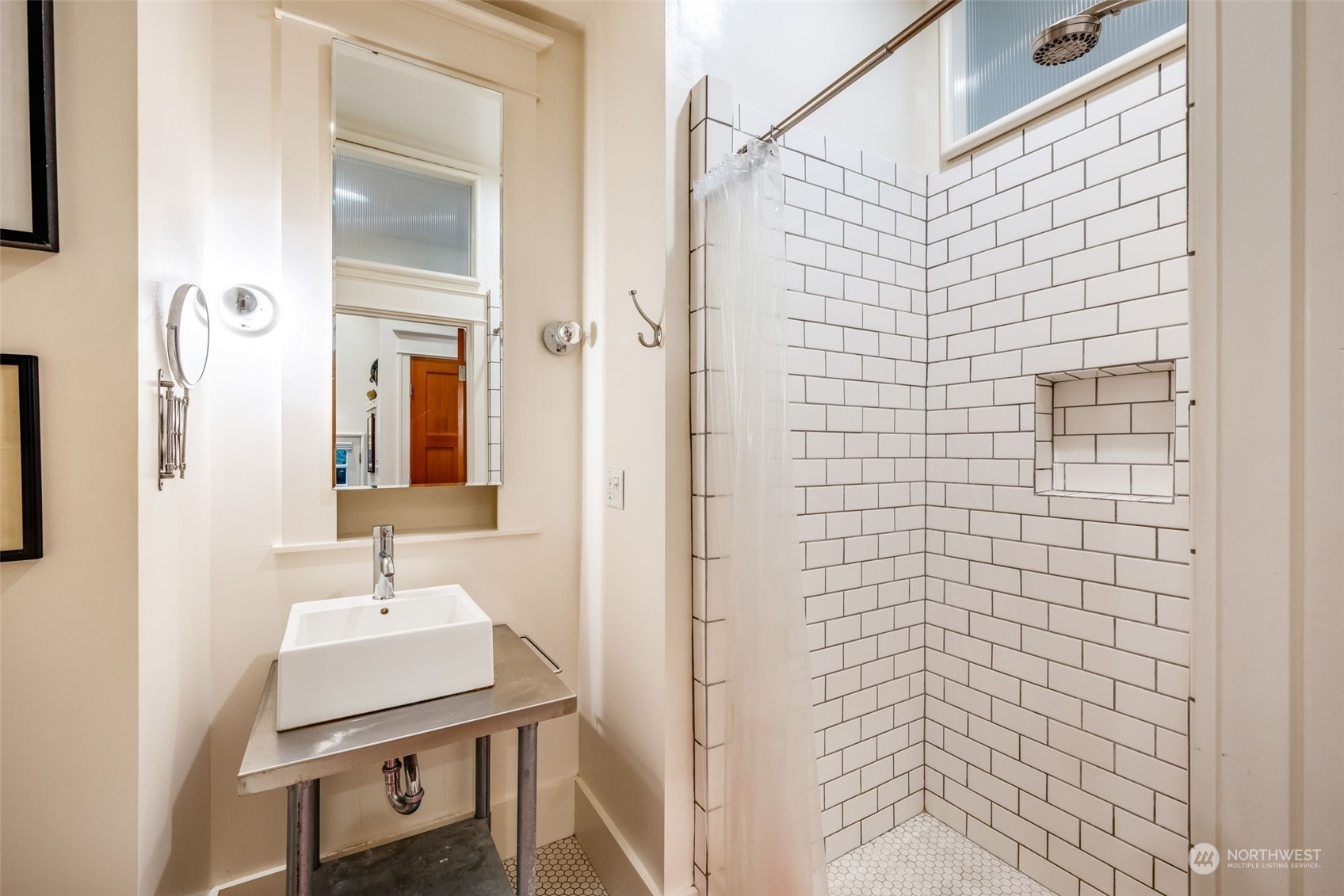926 18th Avenue Seattle, WA 98122 - Photo 33 of 38 a bathroom with a sink a mirror and shower