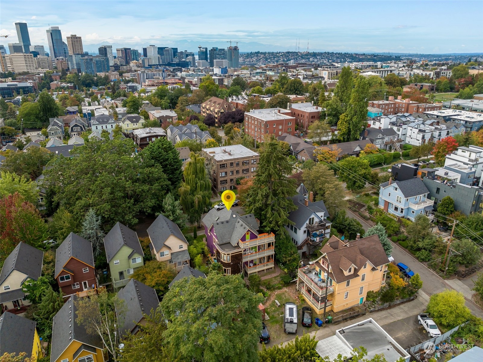 926 18th Avenue Seattle, WA 98122 - Photo 37 of 38 an aerial view of a city with lots of residential buildings ocean and mountain view in back