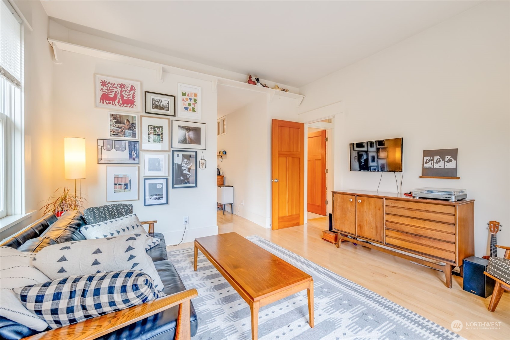 926 18th Avenue Seattle, WA 98122 - Photo 7 of 38 a bedroom with furniture and a wooden floor