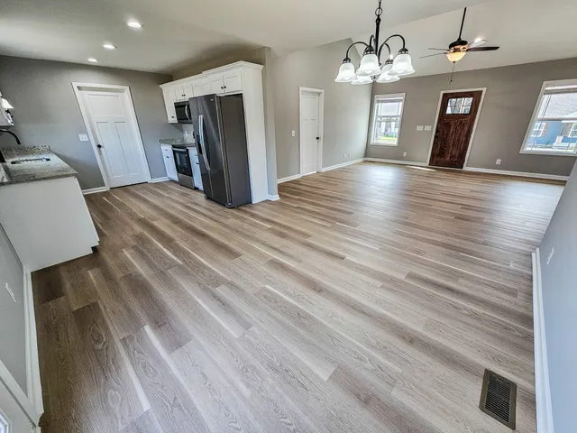 a view of a livingroom with wooden floor