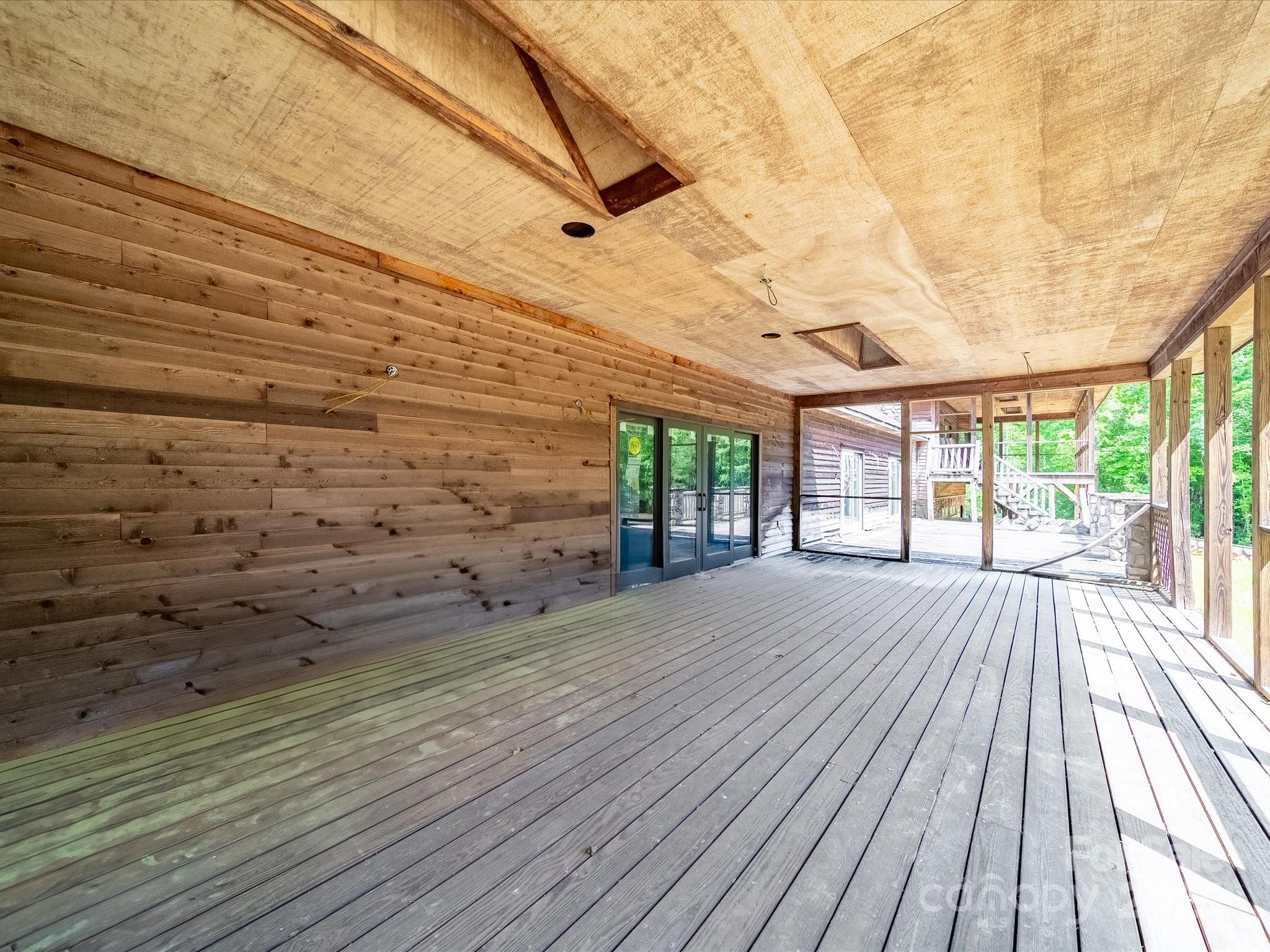 1055 Stone House Road Chapin, SC 29036 - Photo 14 of 30 a view of an empty room with wooden floor and a window