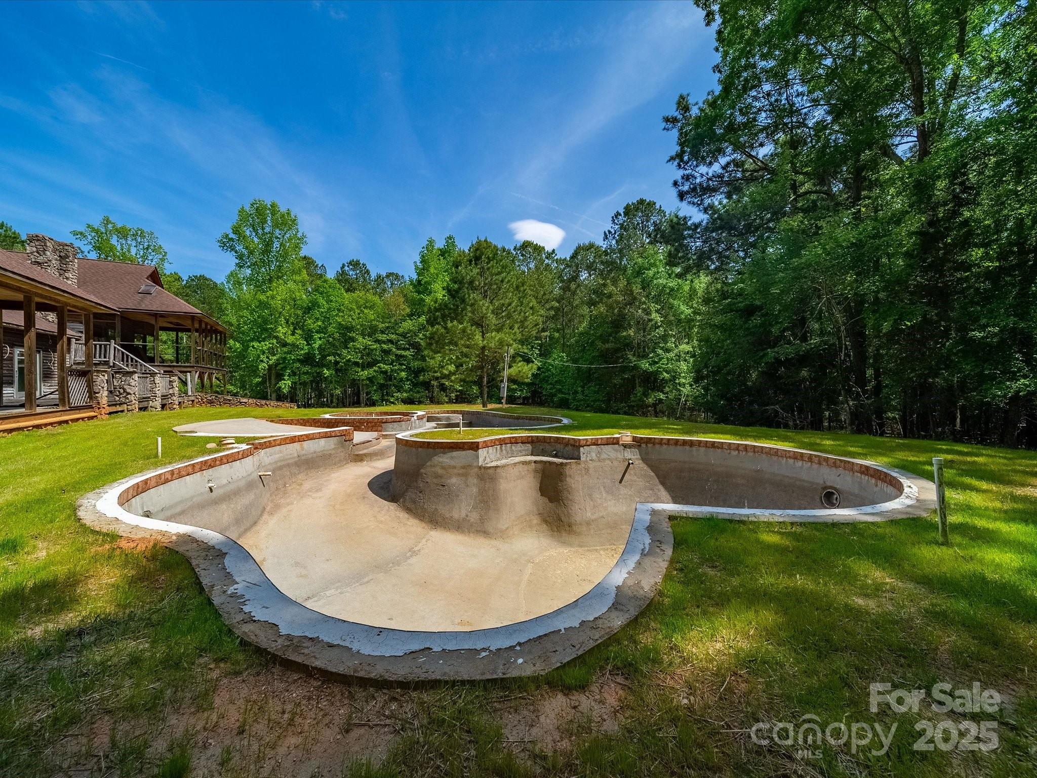 1055 Stone House Road Chapin, SC 29036 - Photo 16 of 30 a view of a swimming pool with a yard