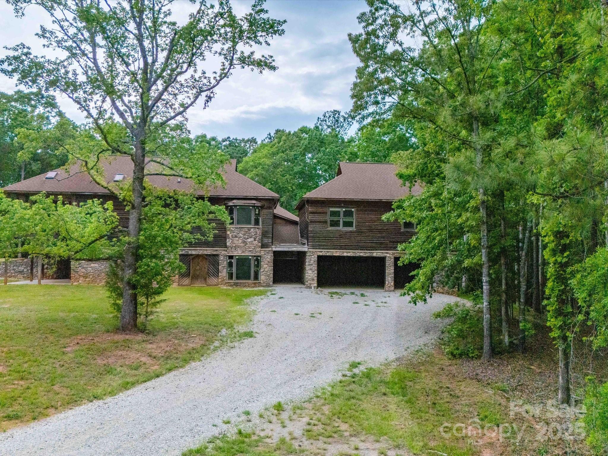 1055 Stone House Road Chapin, SC 29036 - Photo 4 of 30 a front view of a house with a yard and trees