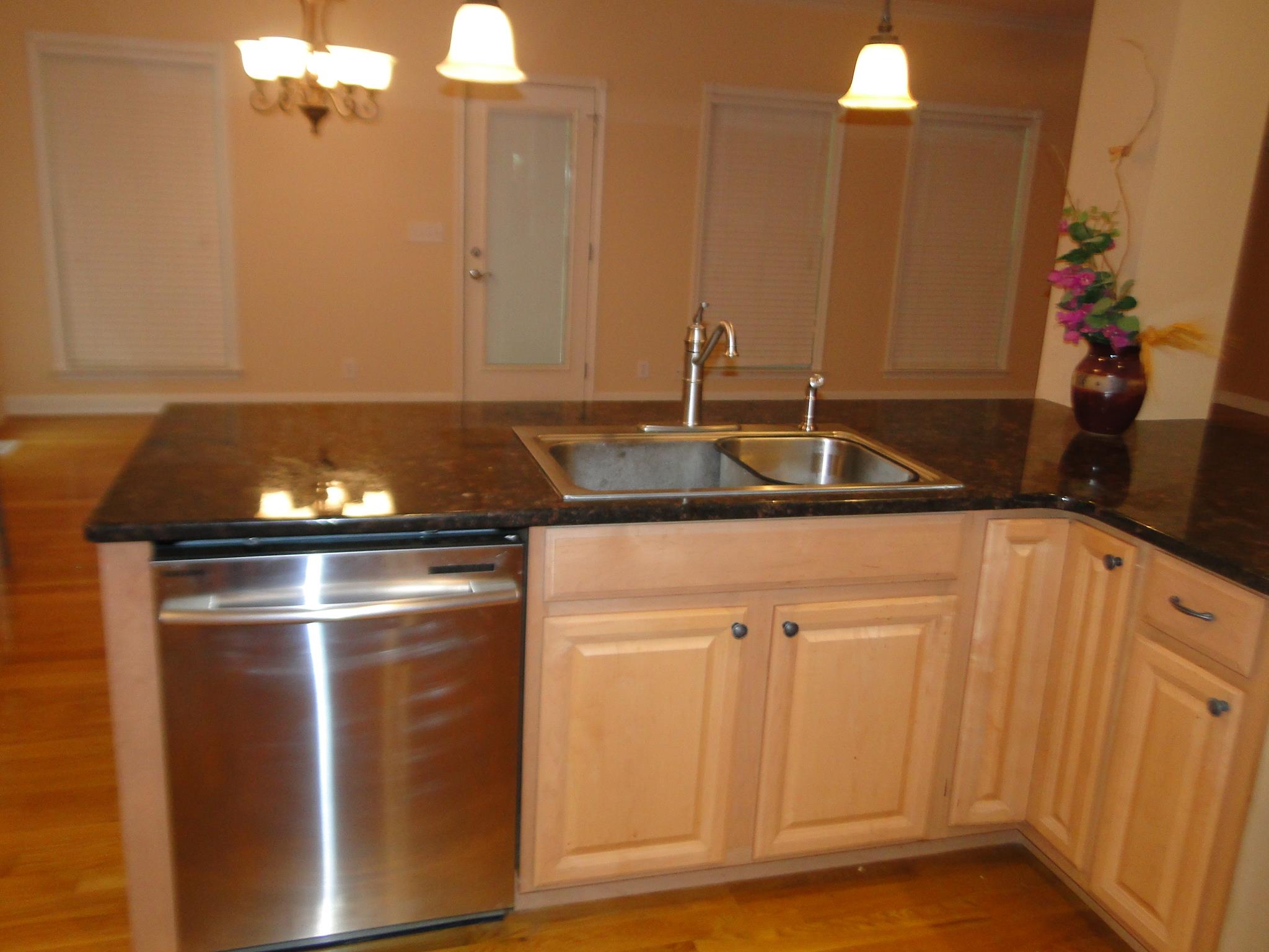 3900 Rowland Road Murfreesboro, TN 37128 - Photo 11 of 29 Kitchen bar with dishwasher & sink looking into the dining area.