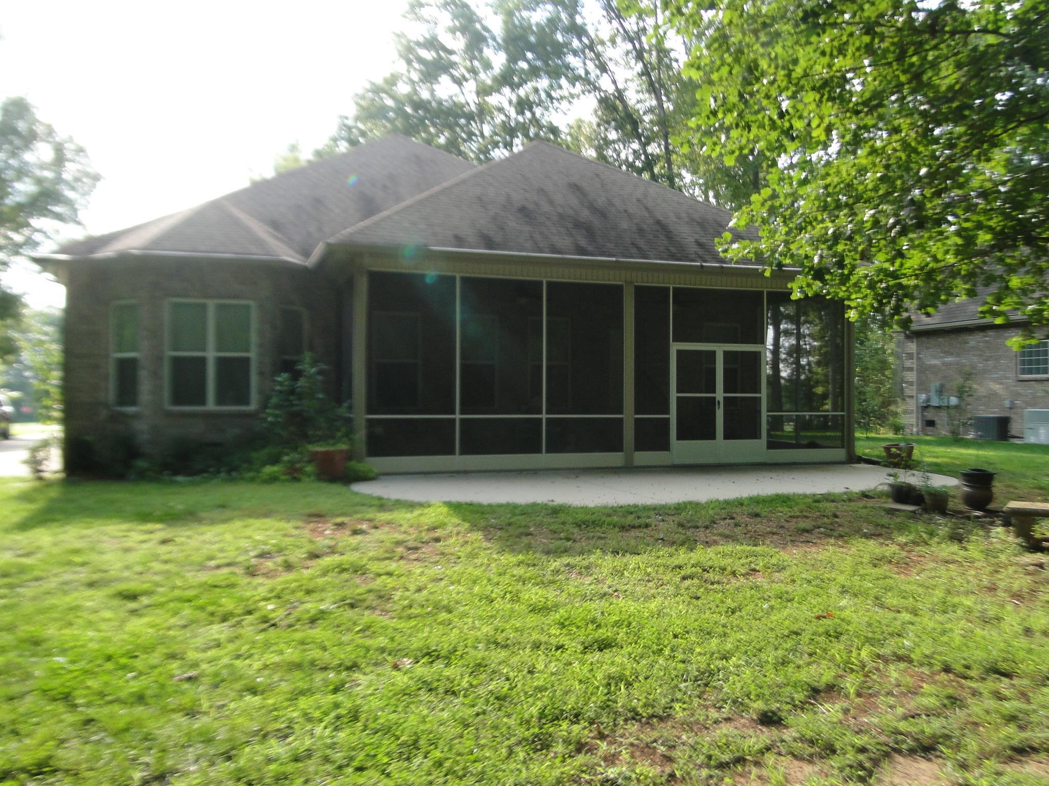 3900 Rowland Road Murfreesboro, TN 37128 - Photo 22 of 29 Home has large covered screened patio & open patio to sit on & enjoy the nature of the countryside.