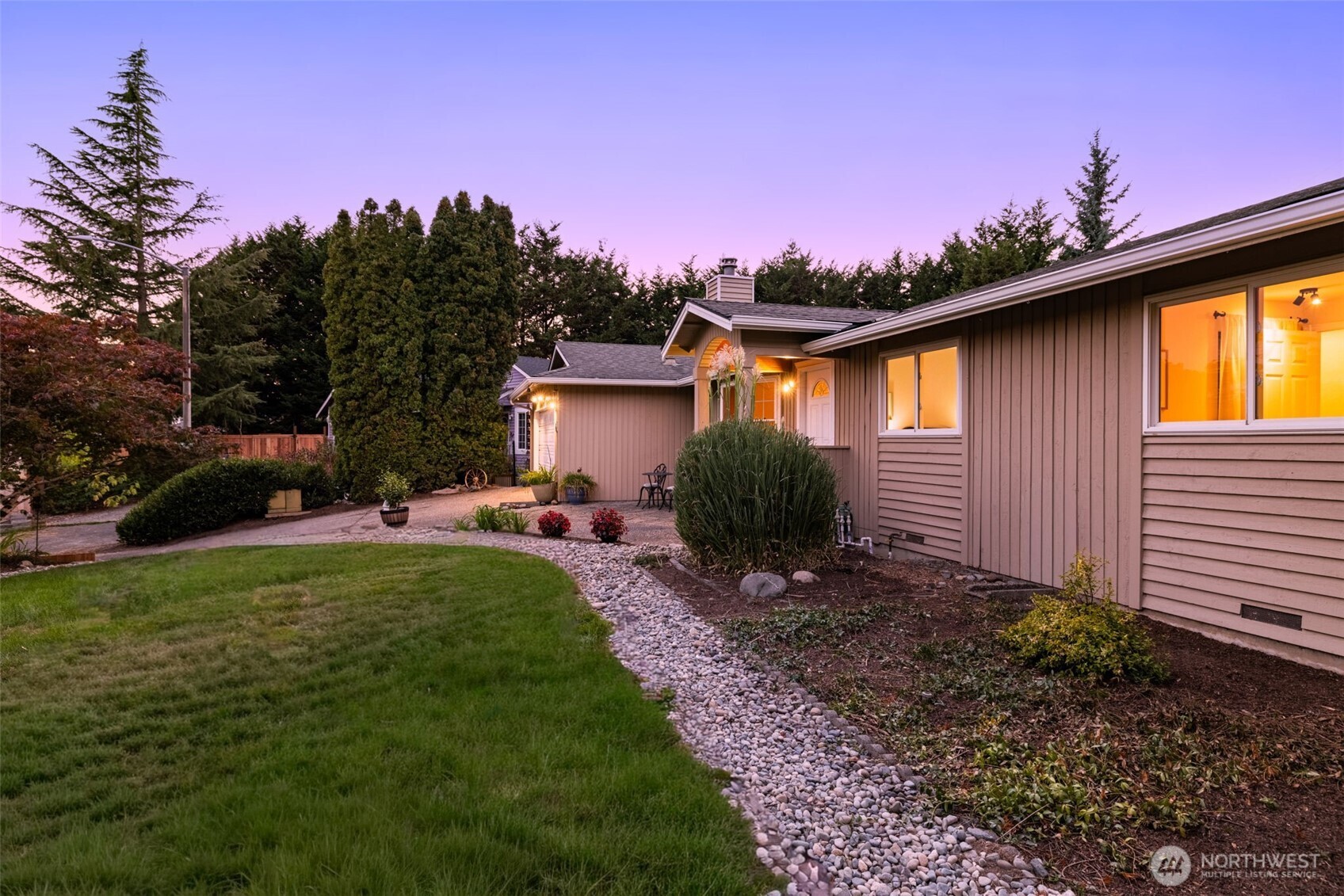 1313 228th Place Southwest Bothell, WA 98021 - Photo 22 of 23 a front view of a house with a garden