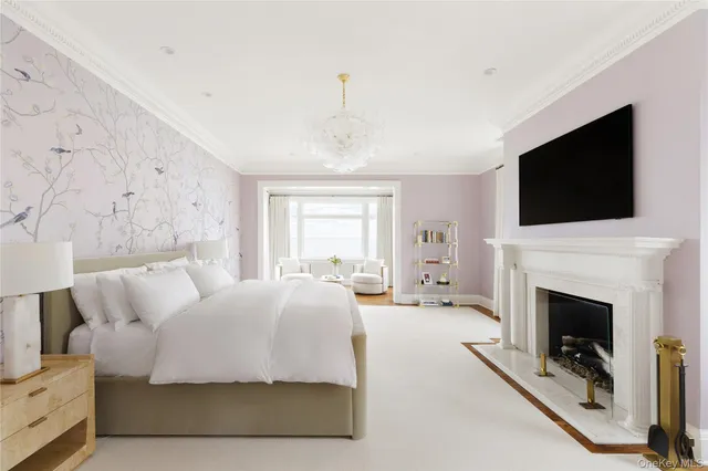 a bedroom with a bed and a fireplace